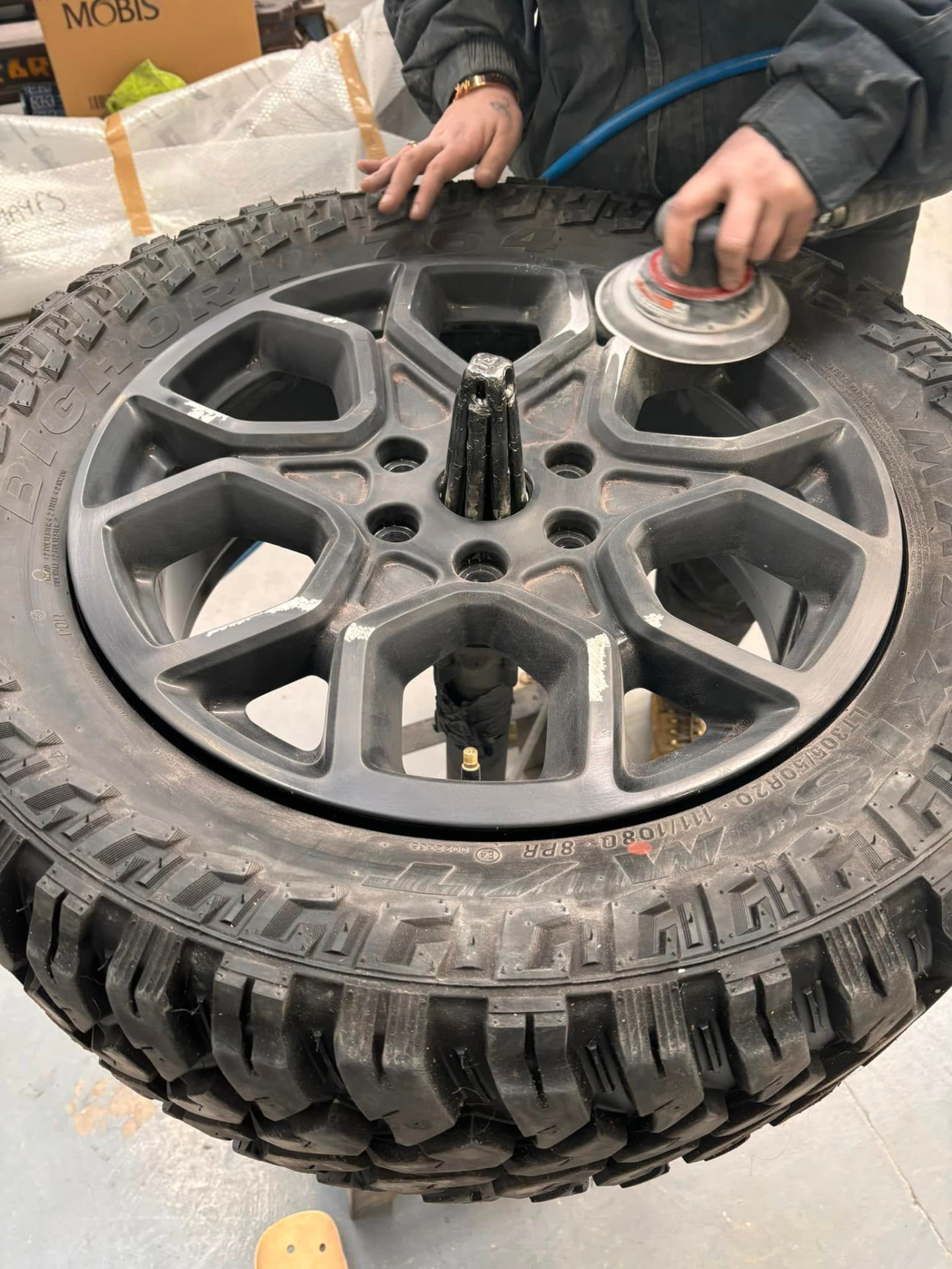 Alloy wheel being prepared for refurbishment