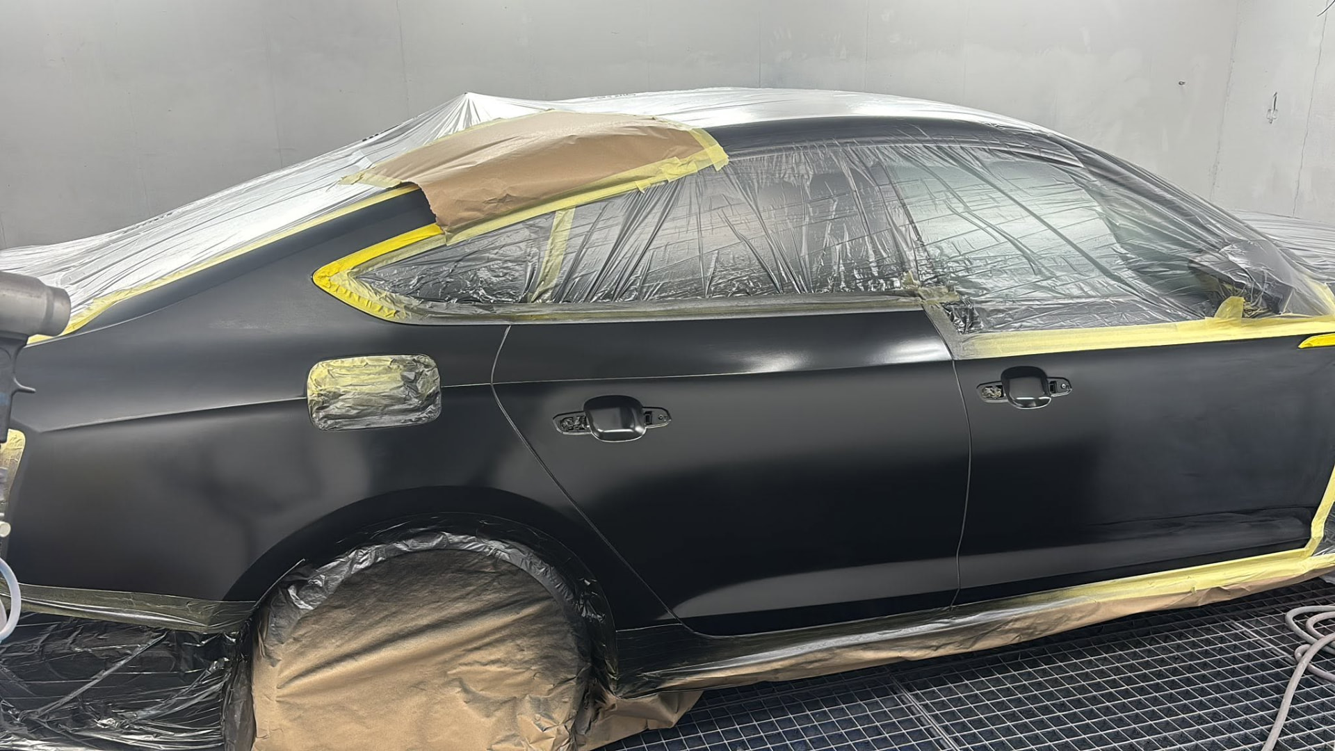 Black car prepared for refinishing